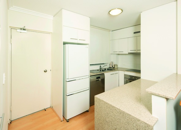 Full modern kitchen — meal prep stays part of the day, supported as needed.